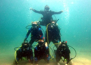 Photo of our staff on a scuba dive having fun at work.
