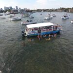 Sandbar in Fort Lauderdale with boats anchored and people swimming, having a good time